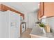 Charming kitchen with wood cabinets, granite counters, white appliances, and natural light at 189 Lochshire Ln, Woodleaf, NC 27054