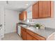 Cozy kitchen with granite counters, wood cabinets, stainless steel sink, and a window at 189 Lochshire Ln, Woodleaf, NC 27054