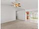 Inviting living room shows seamless flow into the kitchen, with a ceiling fan at 189 Lochshire Ln, Woodleaf, NC 27054