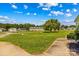 Well-maintained front yard in a quaint neighborhood with mature trees and blue skies at 189 Lochshire Ln, Woodleaf, NC 27054