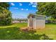 Backyard storage shed with single door and siding. Visible signs of wear and tear at 189 Lochshire Ln, Woodleaf, NC 27054