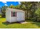 Well maintained backyard storage shed with double doors, red shutters, and a small ramp at 189 Lochshire Ln, Woodleaf, NC 27054