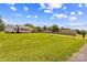 Spacious yard with well maintained grass, a wooden fence and a sidewalk at 189 Lochshire Ln, Woodleaf, NC 27054