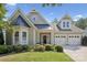 Charming two-story home with a manicured lawn, colorful landscaping, and a two-car garage at 196 Hawks Creek Pkwy, Fort Mill, SC 29708