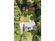 Aerial view showing the house nestled among mature trees at 2019 Lynmore Dr, Sherrills Ford, NC 28673