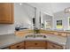 Eat-in kitchen sink and counter detail with breakfast bar overlooking the living room at 2019 Lynmore Dr, Sherrills Ford, NC 28673