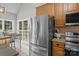 Bright eat-in kitchen featuring stainless steel appliances, tile flooring, and breakfast area at 2019 Lynmore Dr, Sherrills Ford, NC 28673
