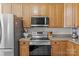 Updated kitchen with stainless steel appliances and wood cabinetry at 2019 Lynmore Dr, Sherrills Ford, NC 28673