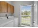 Well-lit laundry room with window view and washer and dryer hookups at 2019 Lynmore Dr, Sherrills Ford, NC 28673