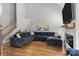 Spacious living room with a large sectional sofa, staircase, and decorative artwork at 2019 Lynmore Dr, Sherrills Ford, NC 28673
