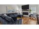 Cozy living room features a large sectional sofa, modern fireplace, and bright, sunlit windows at 2019 Lynmore Dr, Sherrills Ford, NC 28673