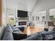 Open-concept living area with a fireplace, large sofa, and views into the breakfast room at 2019 Lynmore Dr, Sherrills Ford, NC 28673