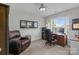Comfortable home office with built-in desk, chair, and natural light from the window at 2019 Lynmore Dr, Sherrills Ford, NC 28673