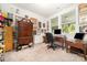Bedroom with neutral carpet, wooden desk, and large windows providing lots of natural light at 232 Orange St, Charlotte, NC 28205