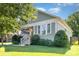 Beautiful craftsman-style home featuring a covered front porch, well-kept lawn, and complemented by mature trees at 232 Orange St, Charlotte, NC 28205