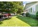 Pleasant street view of a home with a spacious front yard and beautiful tree canopy, enhancing its neighborhood charm at 232 Orange St, Charlotte, NC 28205
