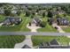 Aerial view showcases a brick home with a circular driveway and manicured front yard at 2872 Wheat Field Ct, Lincolnton, NC 28092