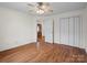 The bedroom boasts hardwood floors, a ceiling fan, and closet space, perfect for a minimalist lifestyle at 2872 Wheat Field Ct, Lincolnton, NC 28092