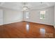 Spacious bedroom with hardwood floors, recessed lights, and natural light from two windows at 2872 Wheat Field Ct, Lincolnton, NC 28092