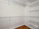Walk-in closet is equipped with adjustable shelving and hanging rods for ample storage space and organization at 2872 Wheat Field Ct, Lincolnton, NC 28092
