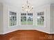 Dining area featuring large windows, hardwood floors and an elegant chandelier at 2872 Wheat Field Ct, Lincolnton, NC 28092