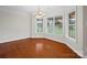 Dining area with large windows providing ample natural light and hardwood floors at 2872 Wheat Field Ct, Lincolnton, NC 28092