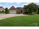 Charming brick home with a well-manicured lawn and attached two-car garage at 2872 Wheat Field Ct, Lincolnton, NC 28092