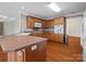 Well-lit kitchen featuring wooden cabinets, sleek countertops, and stainless-steel appliances at 2872 Wheat Field Ct, Lincolnton, NC 28092