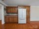 Kitchen with oak cabinets, a refrigerator, and a view of the backyard at 2872 Wheat Field Ct, Lincolnton, NC 28092