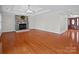 Bright living room with hardwood floors, a stone fireplace, and an open layout at 2872 Wheat Field Ct, Lincolnton, NC 28092