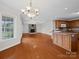 Spacious living room featuring hardwood floors, a fireplace, and an open floor plan into the kitchen at 2872 Wheat Field Ct, Lincolnton, NC 28092