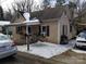 Charming single-Gathering home showcasing a quaint covered porch and a traditional architectural style in a winter setting at 2942 Reid Ave, Charlotte, NC 28208