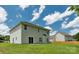 Spacious backyard with a lush lawn and the rear exterior of the home at 3043 Streamlet Way, Monroe, NC 28110