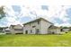 Large, well-maintained backyard with lush green grass and a view of the house's rear facade at 3043 Streamlet Way, Monroe, NC 28110