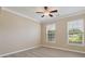 Cozy bedroom with natural light, neutral color palette and ceiling fan at 3043 Streamlet Way, Monroe, NC 28110