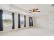 Bright main bedroom featuring a tray ceiling, a ceiling fan, and large windows at 3043 Streamlet Way, Monroe, NC 28110