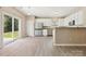 Bright dining area with sliding glass door access to the backyard at 3043 Streamlet Way, Monroe, NC 28110