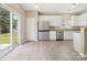 Modern kitchen with stainless steel appliances and breakfast bar at 3043 Streamlet Way, Monroe, NC 28110