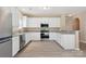 Bright kitchen featuring stainless steel appliances, white cabinets, and stylish countertops at 3043 Streamlet Way, Monroe, NC 28110
