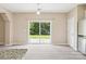 Bright living room featuring a sliding glass door providing abundant natural light at 3043 Streamlet Way, Monroe, NC 28110