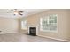 Inviting living room with a fireplace at 3043 Streamlet Way, Monroe, NC 28110