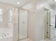 Stylish bathroom with a glass enclosed shower next to a large soaking tub at 3043 Streamlet Way, Monroe, NC 28110