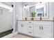 Modern bathroom with double vanity, sleek fixtures, and a tiled shower with glass door at 323 Keswick Ave, Charlotte, NC 28206