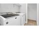 Modern laundry room featuring a new washer and dryer set with sleek design and efficient functionality at 323 Keswick Ave, Charlotte, NC 28206