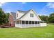 Well-maintained home featuring screened porch, deck, and a spacious, green backyard at 3451 Greene Rd, Monroe, NC 28110