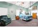 Large bedroom with vaulted ceiling, plush carpet, and comfortable furnishings at 3451 Greene Rd, Monroe, NC 28110