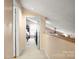 Hallway leading to a bedroom features carpeted floors and a view of the space at 3451 Greene Rd, Monroe, NC 28110