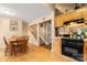 Open layout with kitchen featuring wood cabinets, black appliances, and dining area at 3451 Greene Rd, Monroe, NC 28110