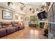 Comfortable living room featuring a fireplace, natural light, and a cozy seating area at 3451 Greene Rd, Monroe, NC 28110