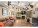 Inviting living room with hardwood floors, fireplace, and vaulted ceiling with unique decorative touches at 3451 Greene Rd, Monroe, NC 28110